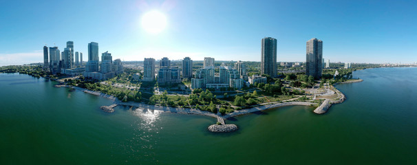 Humber Bay Shores Park city views, green space with skyline cityscape downtown. Skyscrapers over The Queensway on sunset at summer time, near Etobicoke or New Toronto, Ontario, Canada