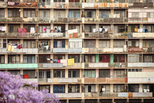 Laundry Hangs On Clothes Lines On Balconies Of A Run Down High-rise Apartment Building In Antananarivo, Madagascar.