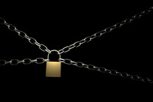 Close-up Of Lock With Chains Against Black Background