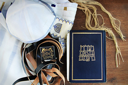 Jewish prayer set: Tanakh (Tanach), Tefillin, Kippah (Kippa), Tsitsit (translated from Hebrew on the book Hebrew Bible Tanakh: Torah, Neviim, Ketuvim, to tefillin: on the head), Israel
