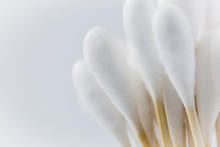 Close-up Of Cotton Swabs Against White Background