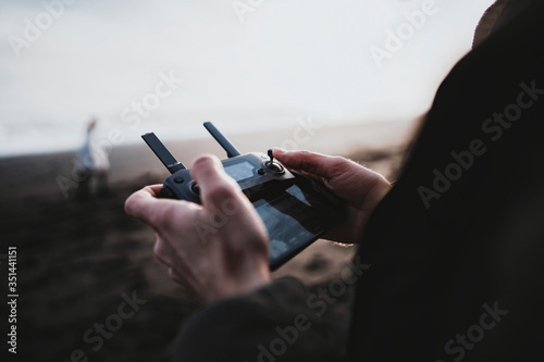 Fotografía Man controlling a drone by a remote control