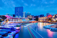 Sunset Blue Hour At Clarke Quay On Singapore River With Boat Light Trails