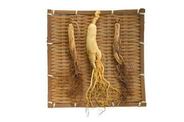 Wall Mural - Fresh and dry ginseng on bamboo weave with isolated on the white background.