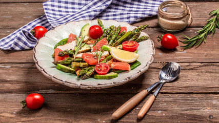 Wall Mural - Ketogenic diet. dish with chicken meat asparagus, avocado, tomatoes. Detox and healthy concept. Keto food. Top view, overhead