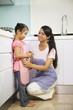 © ImageHit - Girl helping woman in the kitchen