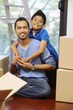 © ImageHit - Boy hugging man from behind