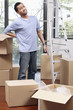 © ImageHit - Man having backache while moving boxes