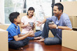 © ImageHit - Family taking a break in new house