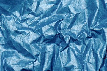 Wall Mural - crumpled blue paper textured background