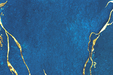 Wall Mural - gold marbling on blue bacground