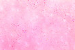 Magenta glitter pattern on a pink background