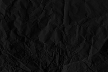 Wall Mural - Crumpled black paper textured background