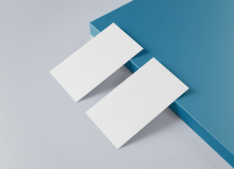 Wall Mural - Two white US business card Mockup laying on blue and grey background 3D rendering
