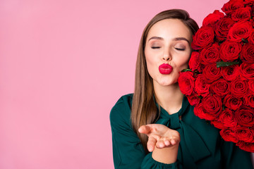 Poster - Closeup photo of pretty charming lady enjoy large one hundred roses bouquet standing side sending kisses empty space wear green blouse isolated pastel pink color background