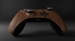 Wood video game controller isolated on darkness background	
