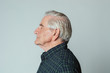 © rawpixel.com - Senior man wearing a tartan shirt in profile shot