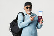 © rawpixel.com - Happy black senior traveler with an air ticket and passport
