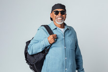 Cheerful Senior Black Man Wearing A Cap And Sunglasses