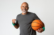 © rawpixel.com - Happy senior man holding a basketball