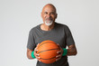 © rawpixel.com - Happy senior man holding a basketball