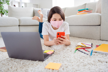 Sticker - Photo of little pupil school lady chatting telephone classmates prepare notebook online lesson teacher lying floor domestic social distance quarantine study use respiratory face mask indoors