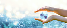 Card For World Oceans Day Or Water Day. Blue Planet Crystal Glass Globe In Human Hand On Pure Sea Background. Saving Environment, Save, Protect Clean Planet And Ecology, Sustainable Lifestyle Concept.
