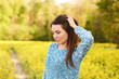 © annanahabed - Spring portrait of happy young woman posing in colza field
