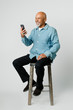 © rawpixel.com - Happy retired man using a smartphone