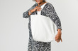 © rawpixel.com - Senior woman holding a tote bag