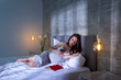 © Impact Photography - Pregnant woman relaxing in bed at night