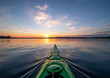 Kayaking at sunset on a calm lake in Northwest Ontario, Canada.