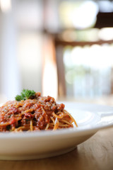 Poster - spaghetti Bolognese with minced beef and tomato sauce garnished with parmesan cheese and basil , Italian food