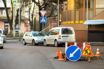 Warning street sign on road work site.