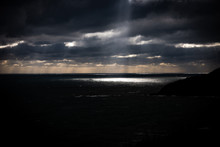 Scenic View Of Sea Against Storm Clouds