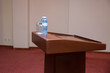 Seminar Podium . Wooden podium tribune stand rostrum . Wooden speech stand in conference room .