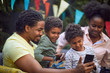 © luckybusiness - afro-american family  at birthday party have fun and making selfie.