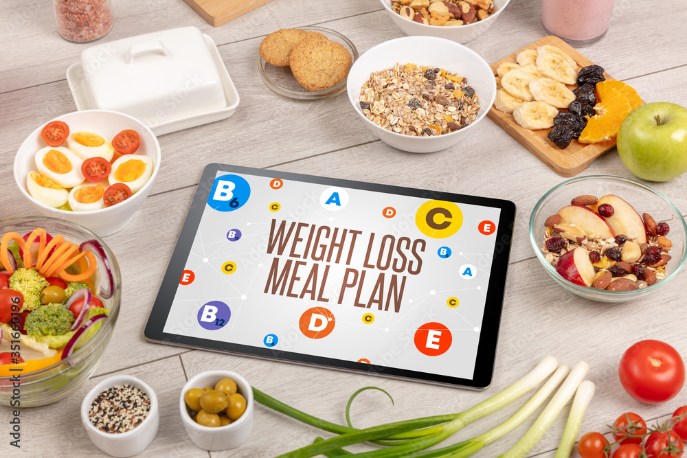 Healthy Tablet Pc compostion with WEIGHT LOSS MEAL PLAN inscription, weight loss concept - obrazy, fototapety, plakaty 