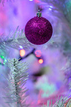 Colorful Christmas Balls On White Tree With Lights Close Up