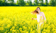 © miroslavmisiura - Girl in a blooming rapeseed field, cheerful happiness