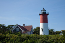 Nauset Lighthouse On The East Coast Of The United States Stands Tall In Red And White As A Beacon Of Safety