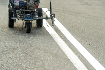 Wall Mural - road painting with airbrush and repair and marking on asphalt pavement