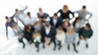 © ASDF - top view. blurry image a group of ambitious young business people.