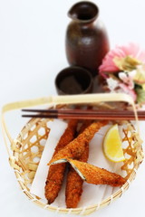 Wall Mural - Japanese food, Shishamo deep fried and lemon in bamboo basket