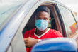 © Vic Josh - young handsome african taxi driver wearing face mask preventing, prevent, prevented himself from the outbreak in the society