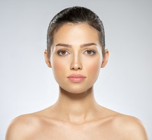 Beautiful Face Of Young Caucasian Woman With Perfect Health Fresh Skin.  Skin Care Concept. Closeup Face Of A  White Brunette Woman Looking To The Camera. Perfect Skin Of A Caucasian Adult Girl