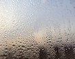 © schankz - Drops of water on a glass window at dawn as an abstract background.