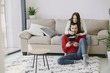 © prostooleh - Couple with joysticks. People at home. Pair playing a video games.