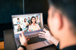 © Tom Wang - young man working at home and using laptop computer with video conference