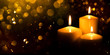 Burning candles with festive bokeh on a black background. Holiday concept.